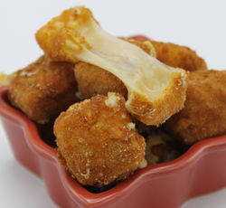 Une portion de comté frit à la milanaise