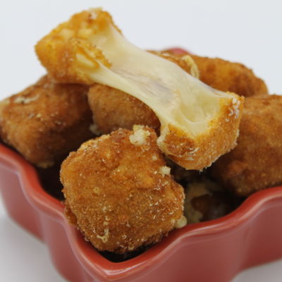 Une portion de comté frit à la milanaise